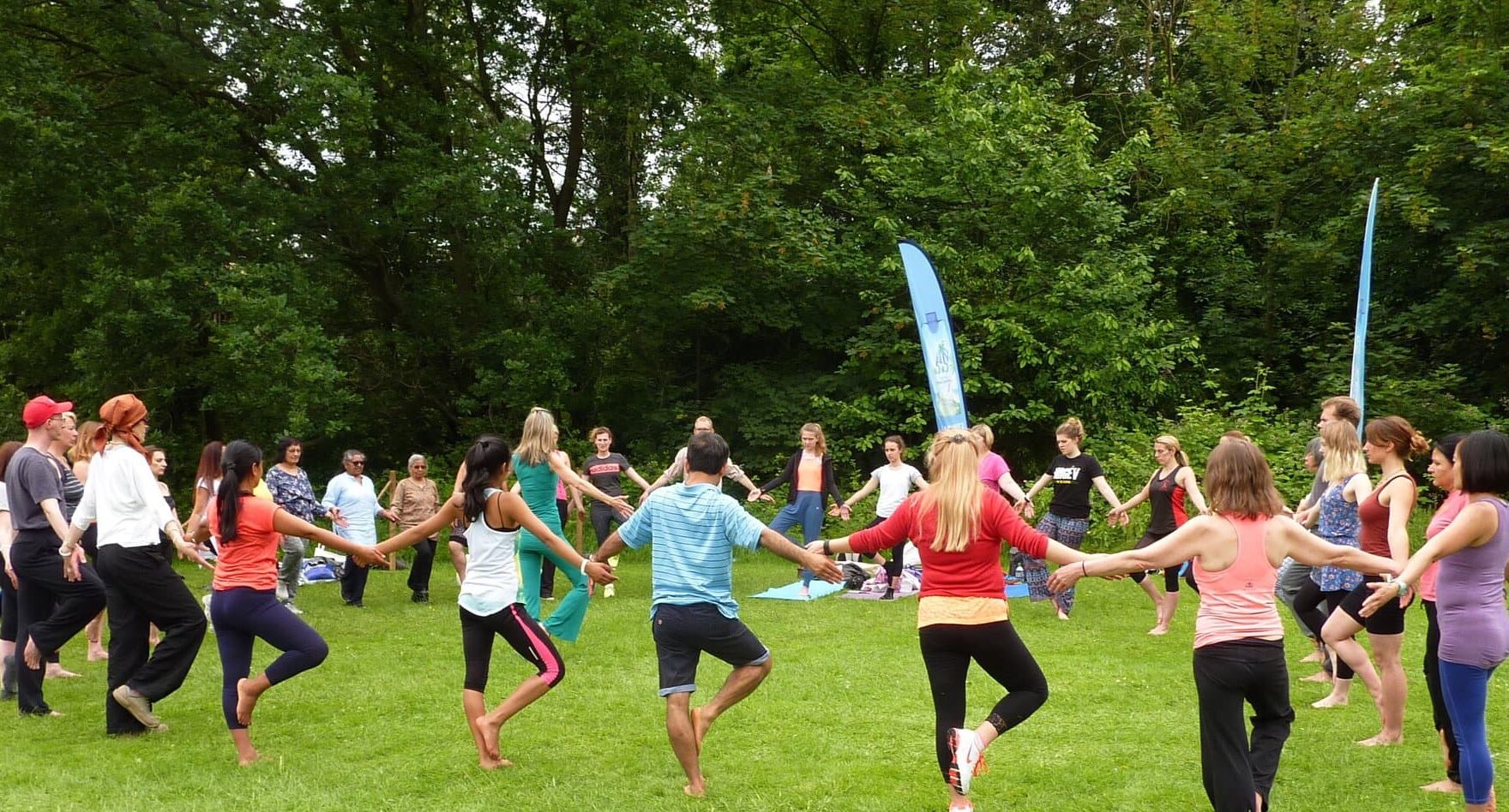 Loulou James leading a yoga class at International Yoga Day, Alexandra Palace