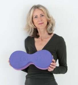Loulou James, designer of the Buttafly yoga prop, and creator of the Buttafly Technique, a pioneering approach to natural back care and spine health.