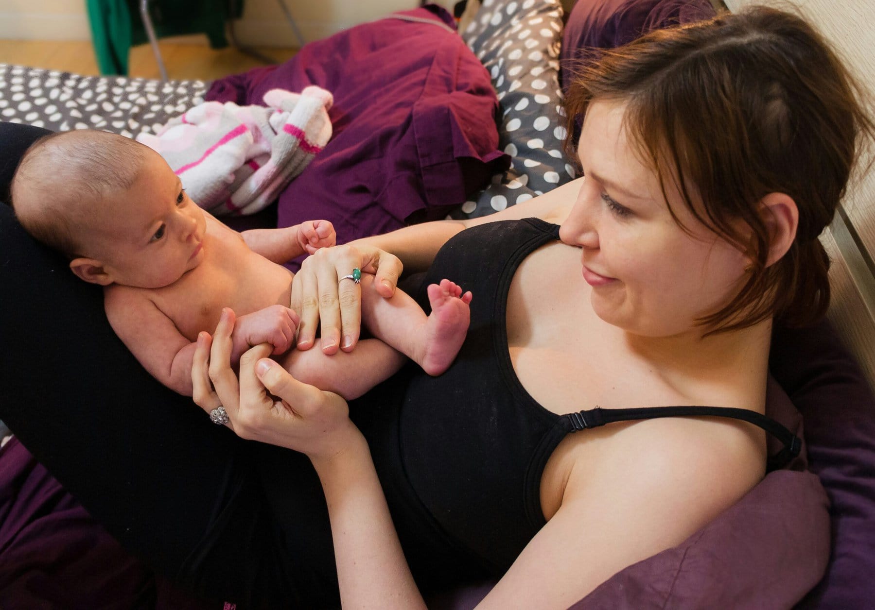 Coccyx (tailbone) pain can result from trauma during childbirth and can make sitting and defecation painful.